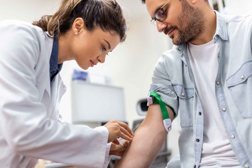 patient getting a blood test at a pharmacy 